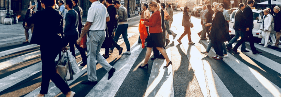 Group of people crossing a city street